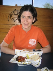 Kira, in front of her bacon cheeseburger at Buffalo Wild Wings