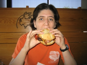 Kira eating a burger at Buffalo Wild Wings