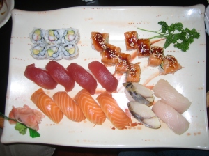 A tray of sushi at Asuka, including salmon, tuna, mackerel, and yellowtail nigiri, plus a California roll and a "Fantacy Dream" roll.