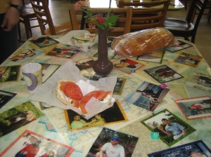 The table at Bloomington Bagel Company, with pictures of people with bagels.