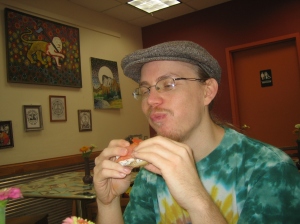 Erik, enjoying his bagel at Bloomington Bagel Company
