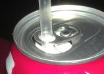 The correct way to put a straw into a can of soda.