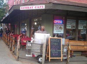 Exterior of Bombay Cafe, with crêpe stand out front 