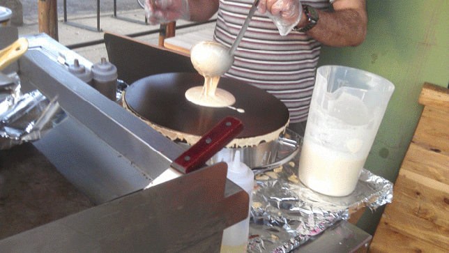 Making a crêpe at Bombay Cafe